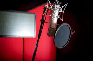 microphone with a pop filter in a red studio