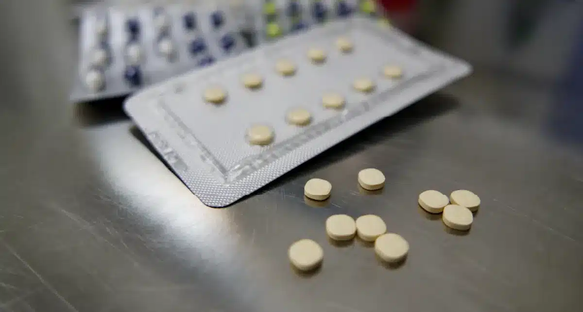 Fentanyl pills and blister packs on a stainless steel surface