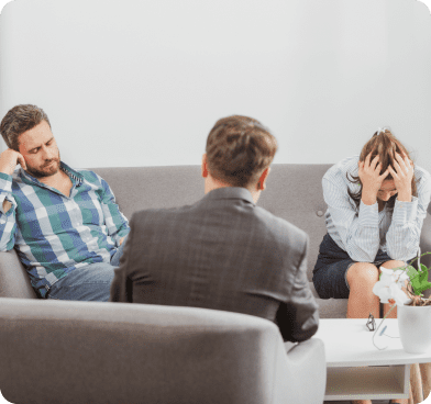 couple stressed while talking to therapist