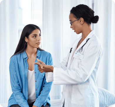woman speaking to doctor