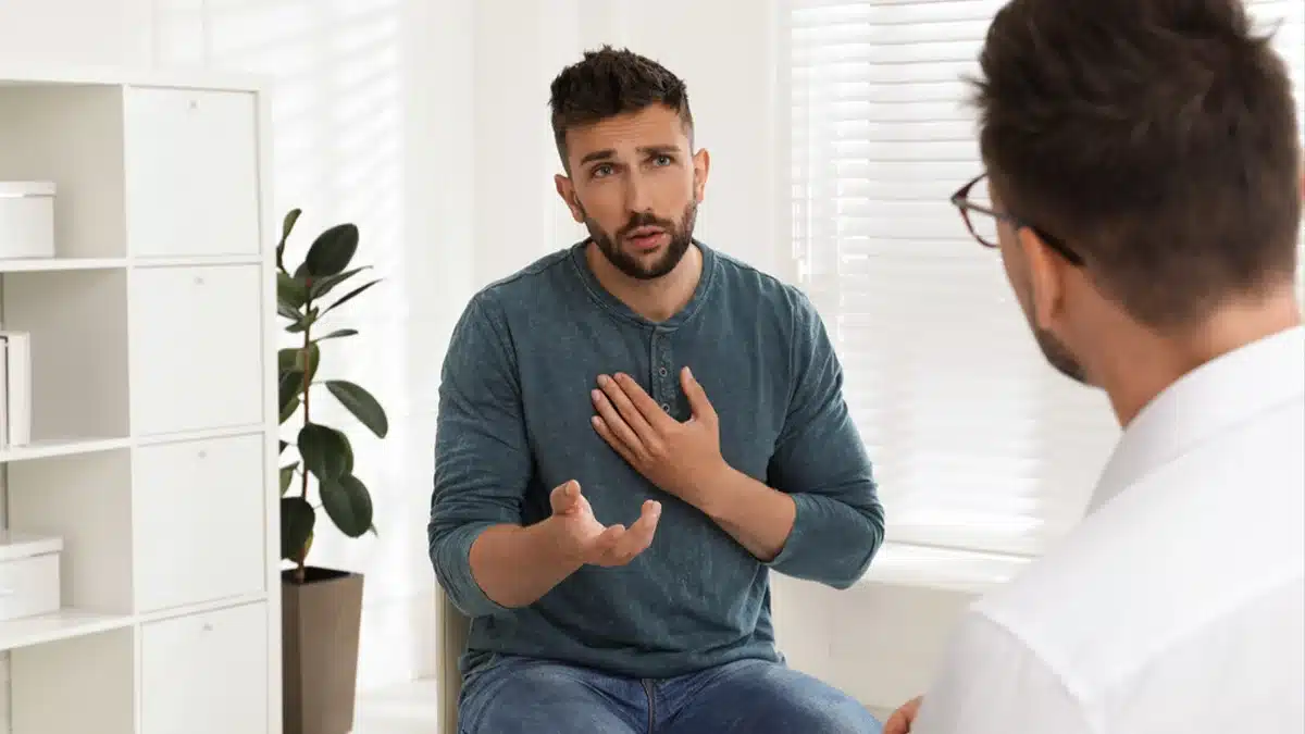 Man consoling with doctor