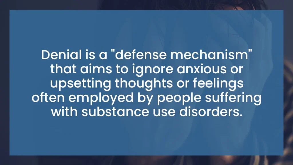 A promotional graphic featuring the text, 'Denial is a "defense mechanism" that aims to ignore anxious or upsetting thoughts or feelings often employed by people suffering with substance use disorders,' overlaid on a blurred background image