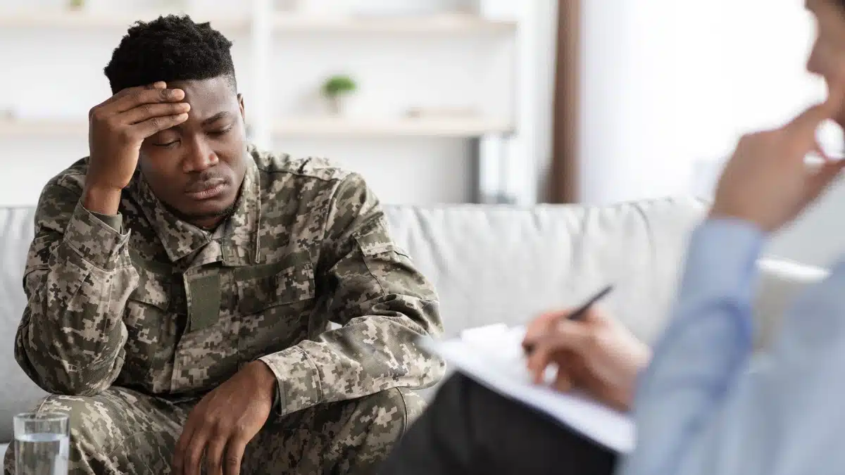 Veteran receiving counseling and support during substance abuse treatment.