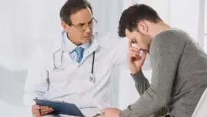 Doctor talking to a distressed patient