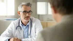 Focused shot of a doctor talking to his patient