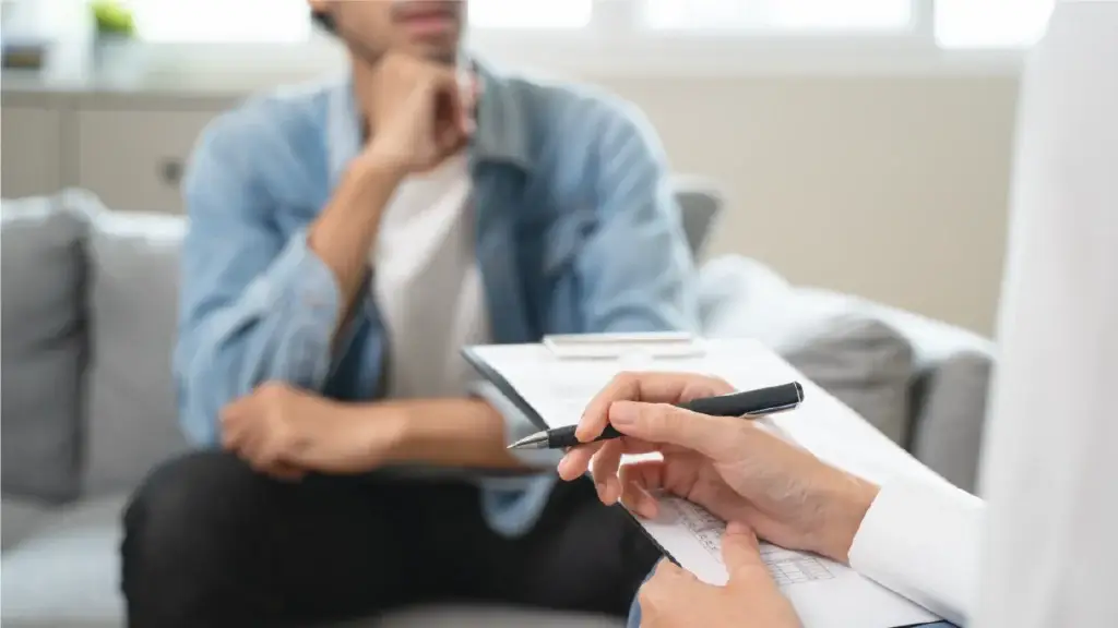 man talking to his nurse