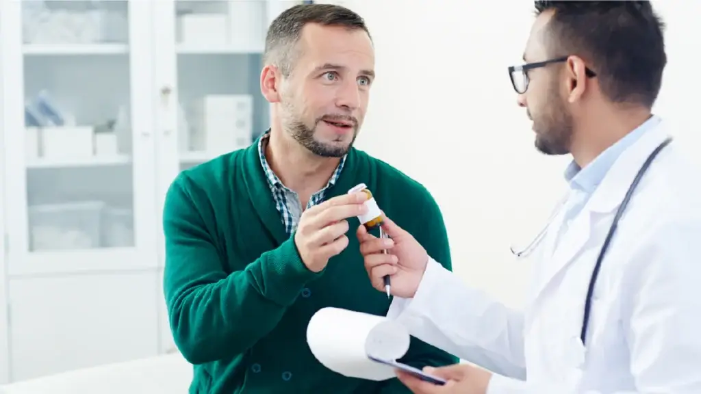 Doctor handing over Prozac to a patient