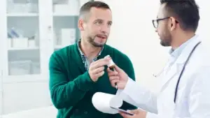 Doctor handing over Prozac to a patient