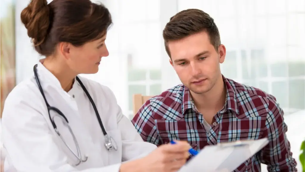 Nurse pointing information out to her patient