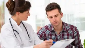 Nurse pointing information out to her patient