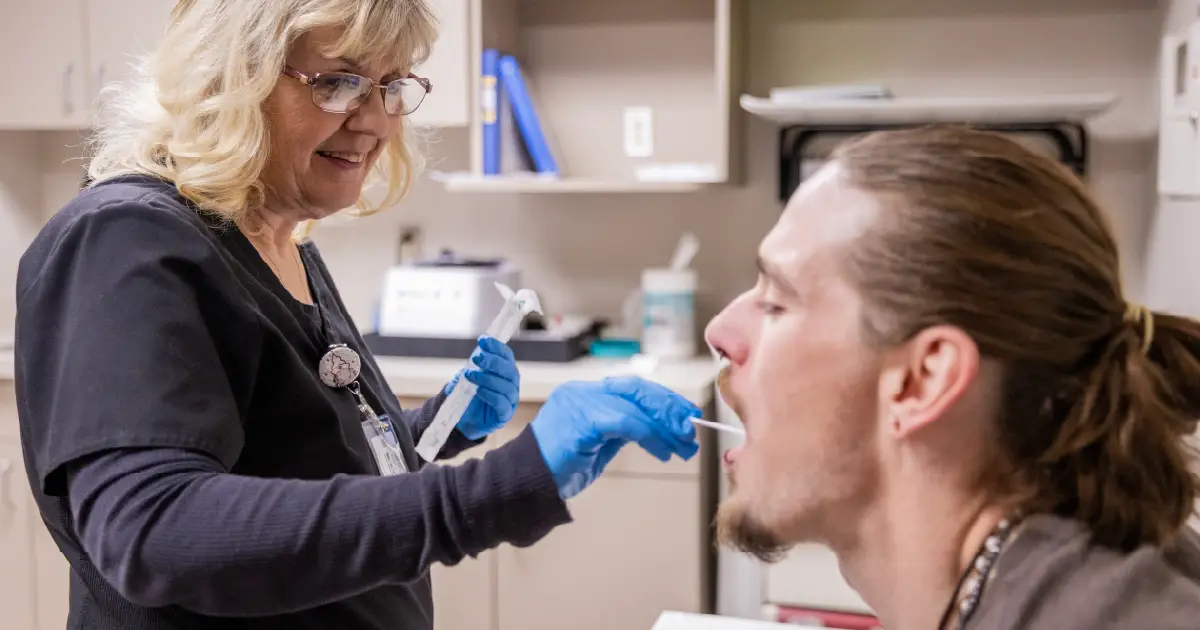 Genesight Testing being conducted by swabbing the patients cheeks