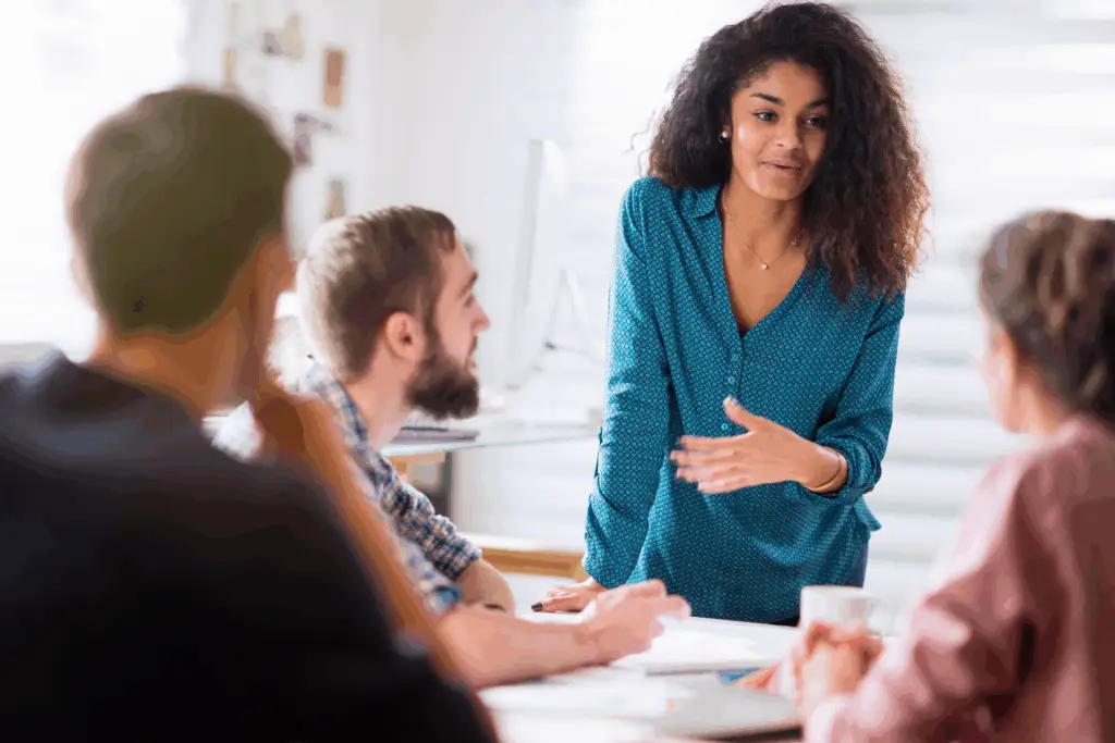 Peer coach speaking with a woman in a supportive conversation during a recovery session