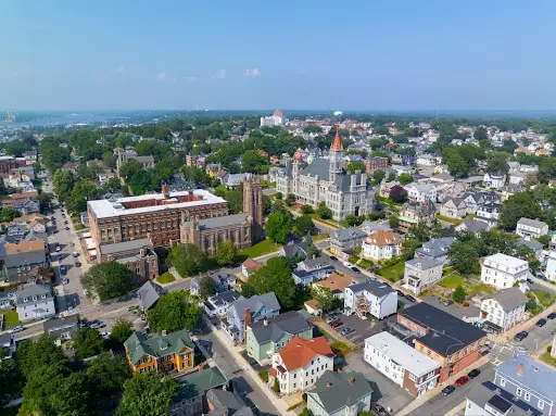 Aerial view of Fall River, Massachusetts downtown with historic buildings and residential areas.
