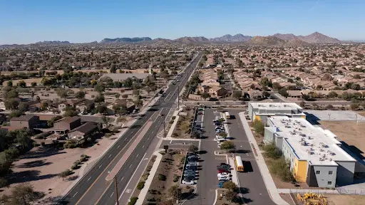 San Tan Valley, Arizona — aerial view of suburban neighborhood with wide road and houses.