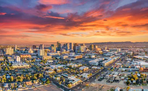 Arizona — city skyline at sunset with colorful sky.