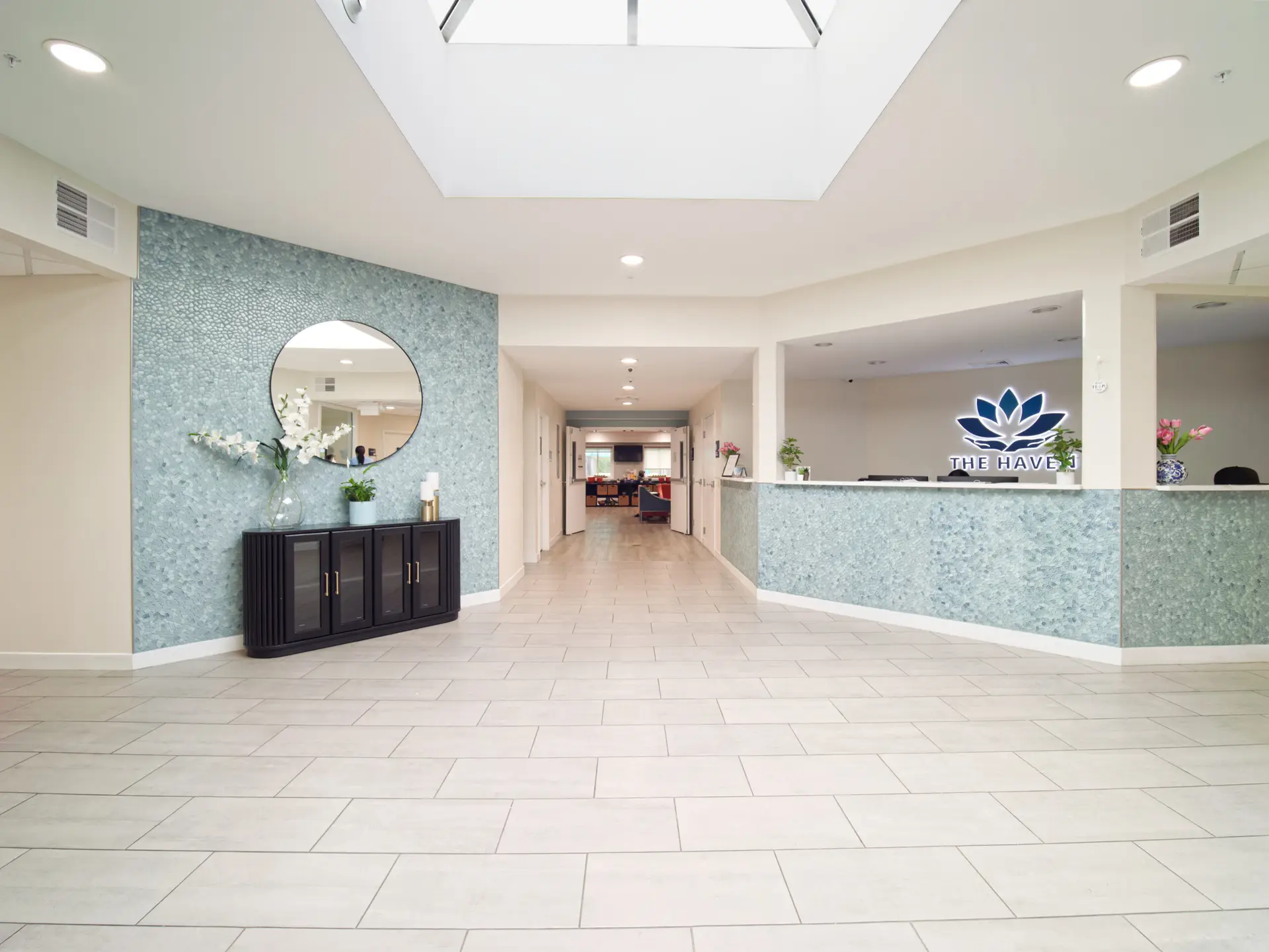 Bright and welcoming lobby at The Haven Detox New Jersey with large office desk and reception area