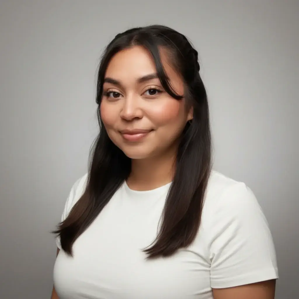 Professional headshot of a woman with long dark hair, wearing a white top, smiling softly against a neutral gray background.
