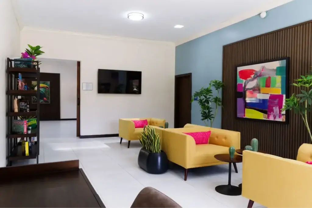 The Haven Detox Puerto Rico indoor seating area with games and clean desk space.