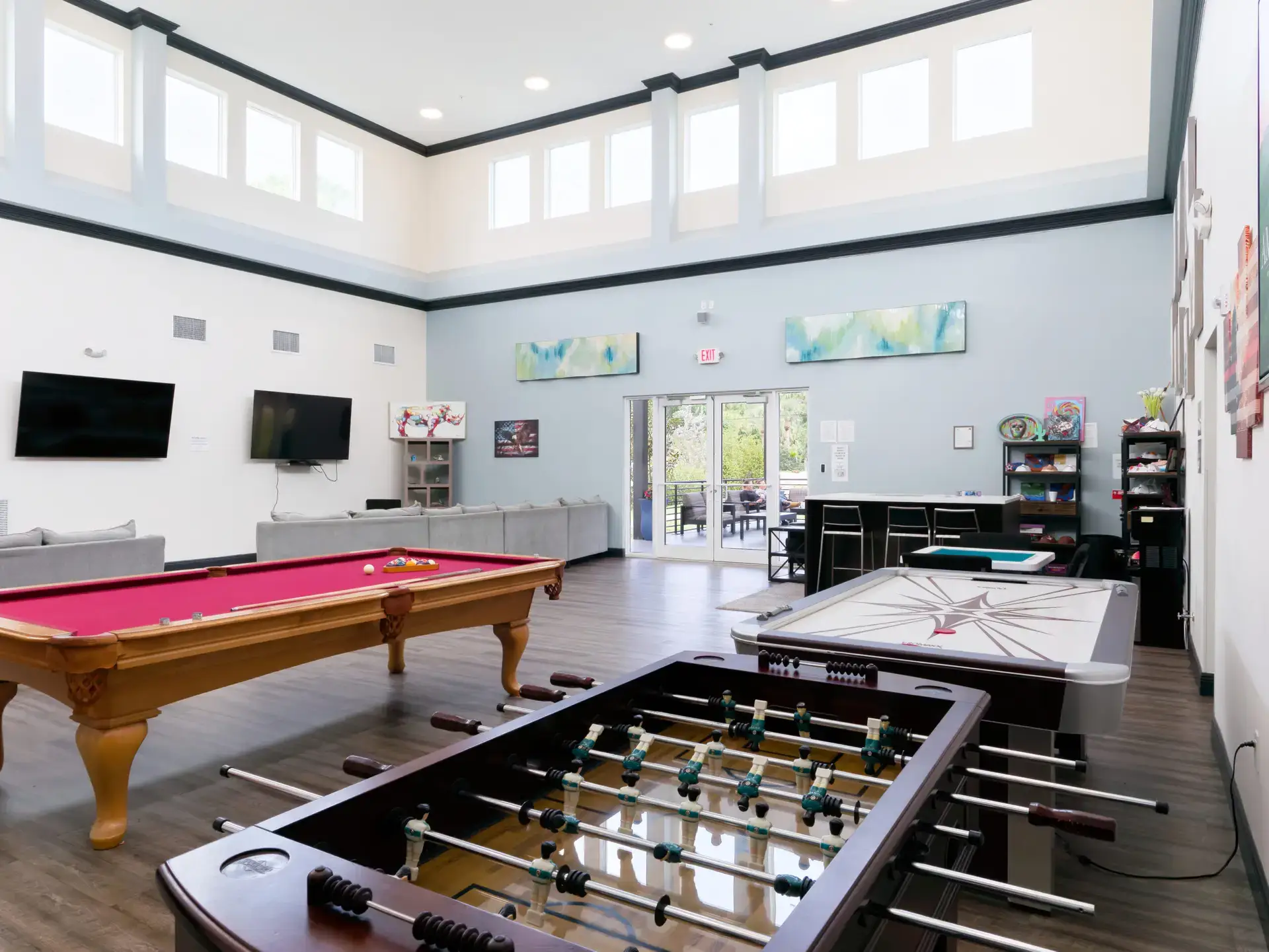 Recreation room with pool table, foosball, and games at The Haven Detox Florida in West Palm Beach, Florida.