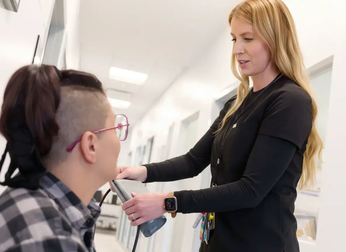 Nurse performing a routine wellness assessment by checking a patient's blood pressure at The Haven Detox Massachusetts in Worcester, Massachusetts.