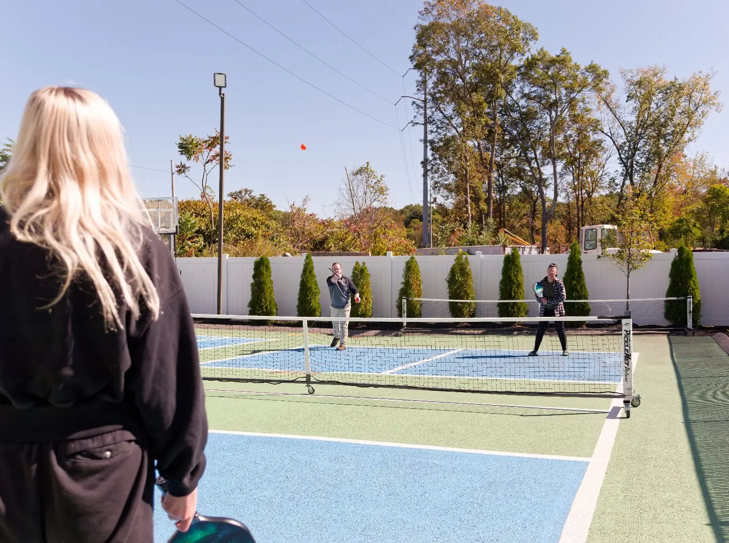 Patients enjoying the outdoor pickleball courts at The Haven Detox Massachusetts in Worcester, Massachusetts.