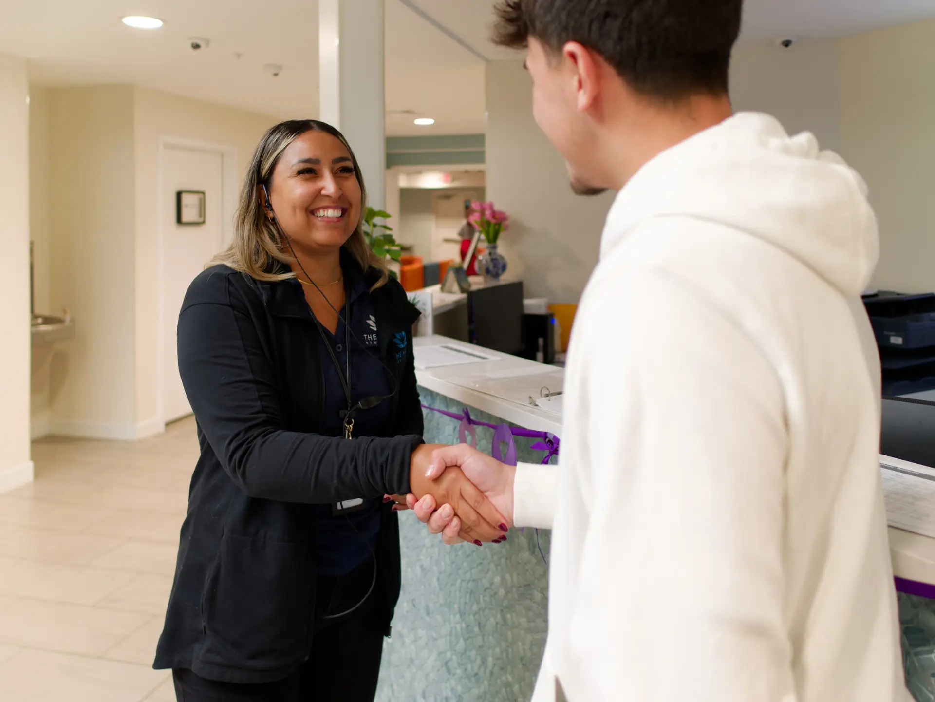 Staff member welcoming a patient at the reception desk of The Haven Detox New Jersey in Blackwood, New Jersey