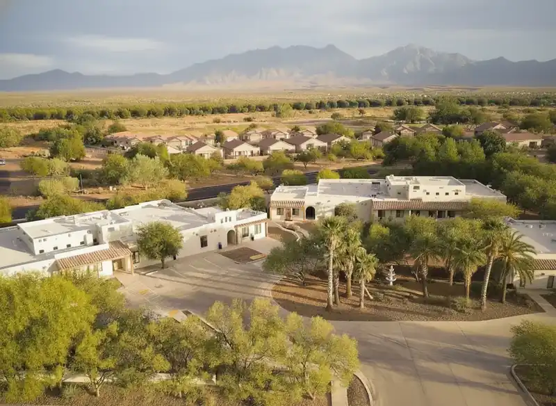 Aerial view of The Haven Detox Arizona facility with mountain backdrop and palm trees